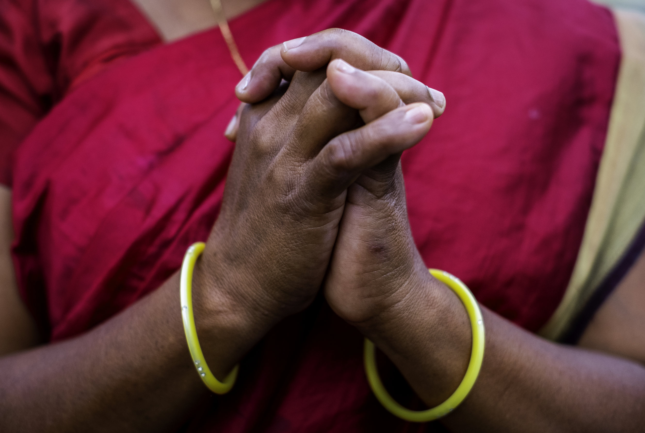   A widow in Kandhamal, India, folds her hands in prayer. During the Summer of 2008 a mob of Hindu nationalists aligned with Prime Minister Narendra Modi’s BJP party, murdered her husband before her eyes for their Christian faith. After 10 years, she