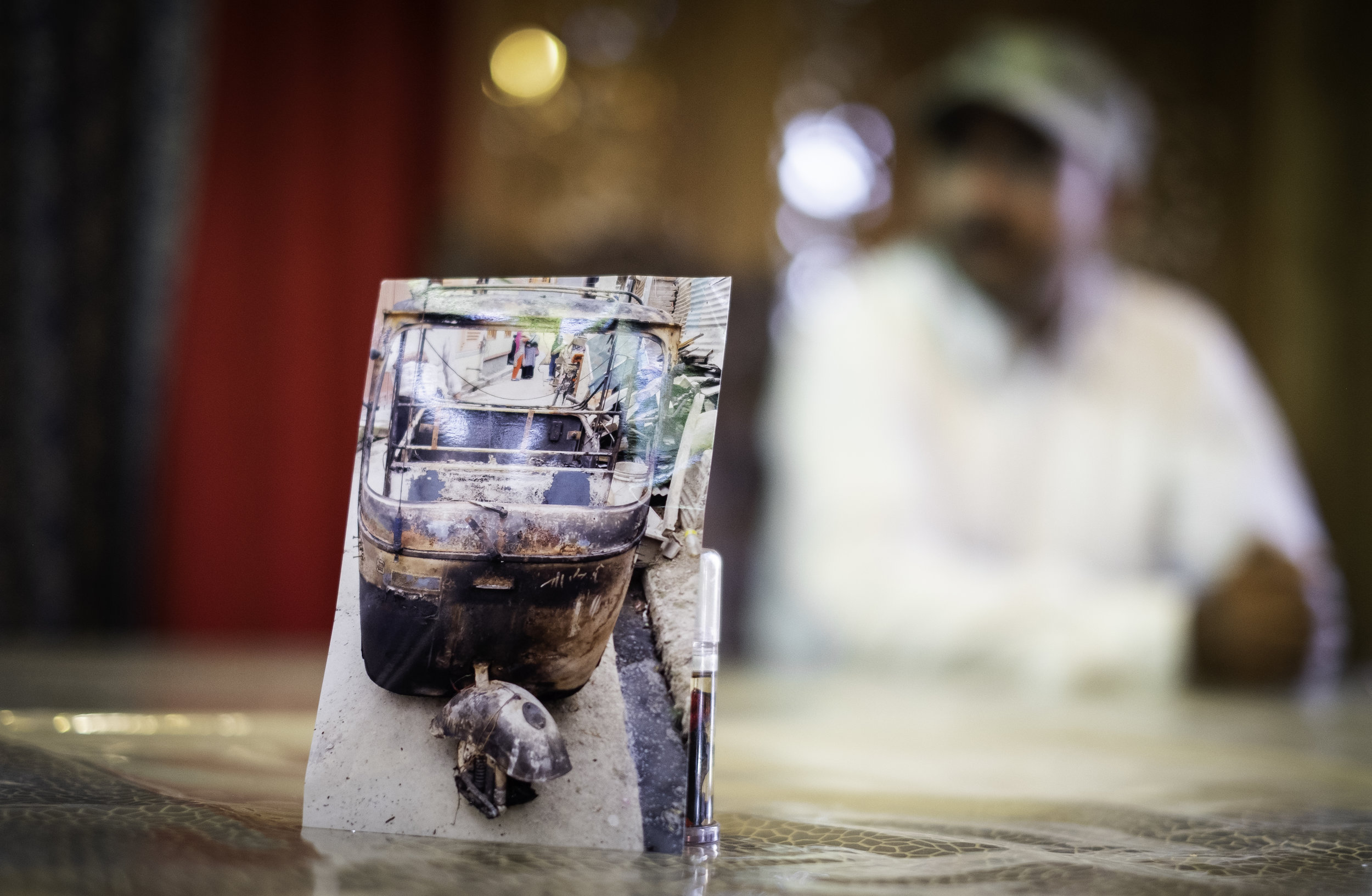   Abel, a Christian taxi driver from Srinagar, displays a photograph of his taxi that was destroyed by a group of Kashmiri Muslims after his faith was made public. He must now rent taxi’s, which limits his income to provide for is family. (Real name 