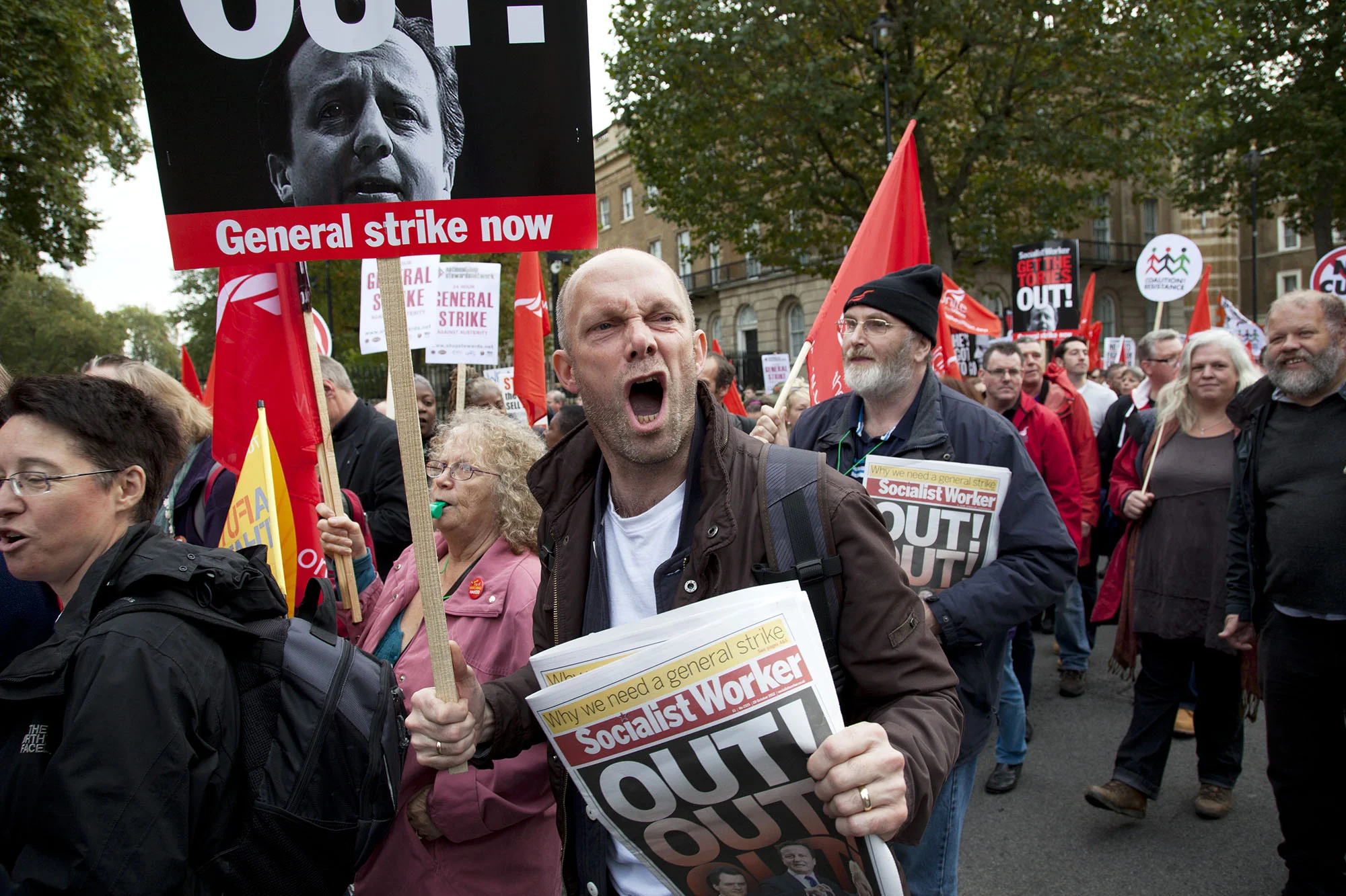 Protester shouts towards Downing Street during the TUC march 'A Future That Works' demonstration against austerity cuts.