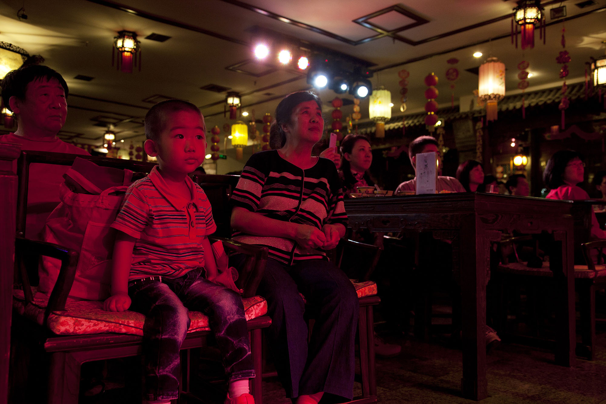  A young member of the audience watches the show at Laoshe teahouse. 