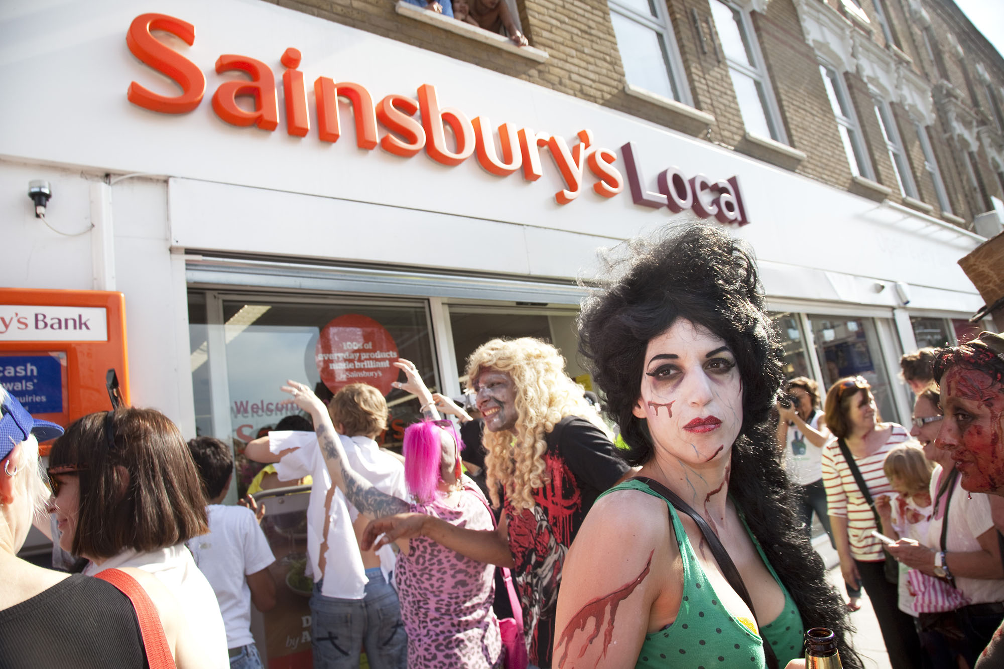  An undead Amy Winehouse at the Stoke Newington Zombie-a-thon protests against Sainsbury's supermarket in the area. 