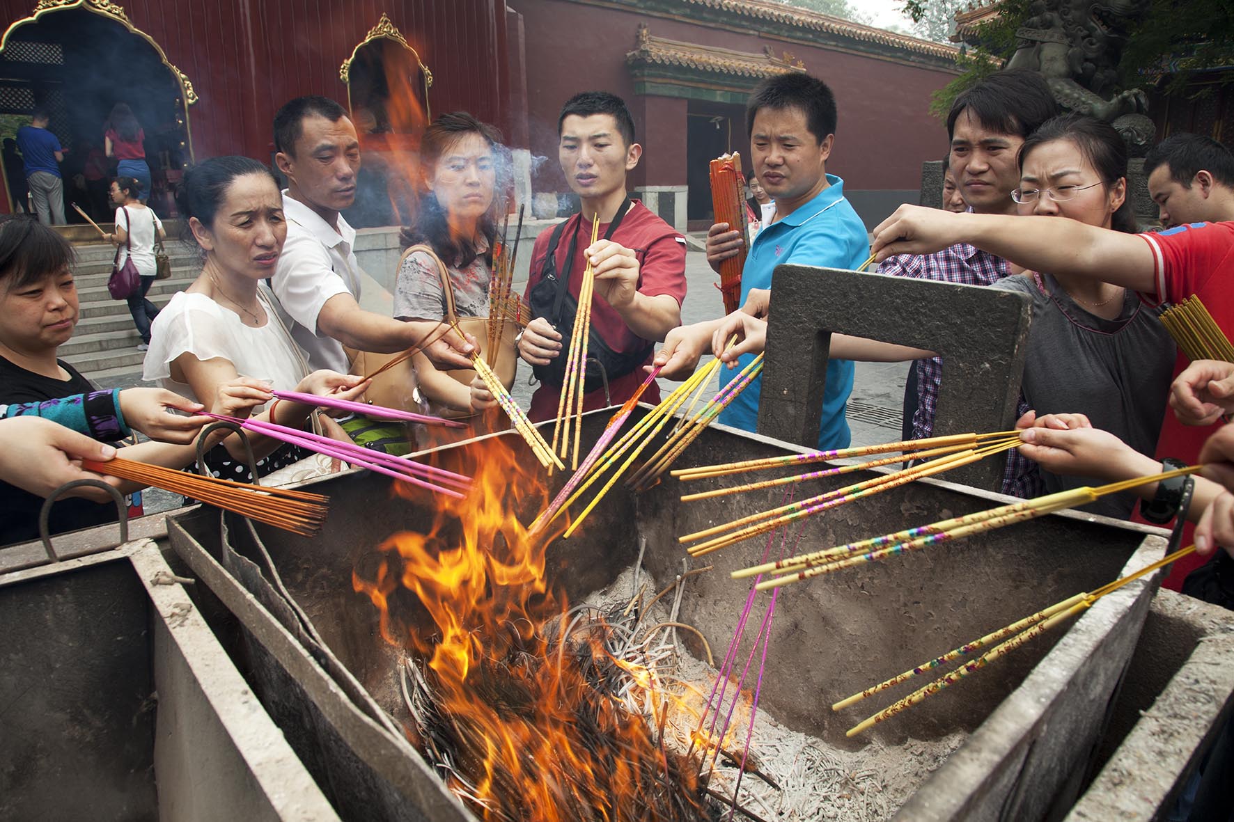  People come to pray and burn incense sticks at The Yonghe Temple, also known as the "Palace of Peace and Harmony Lama Temple". 