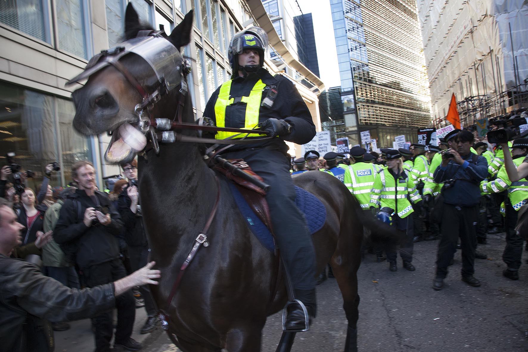  Police horses in riot gear are deployed in The City of London as students march to protest against rises in tuition fees and changes to higher education. 