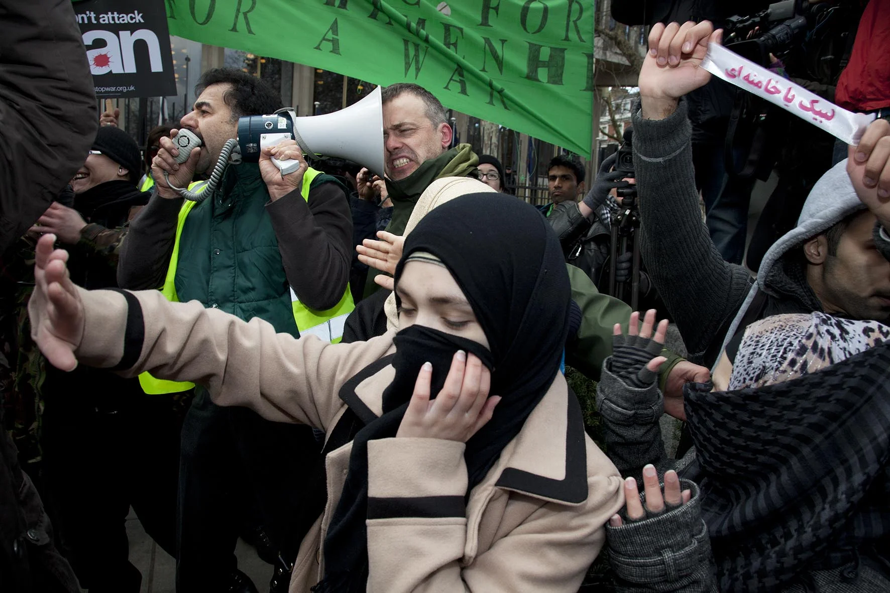 Arguments and scuffles break out between Free Iran demonstrators at Stop The War Coalition rally outside the US Embassy in London.