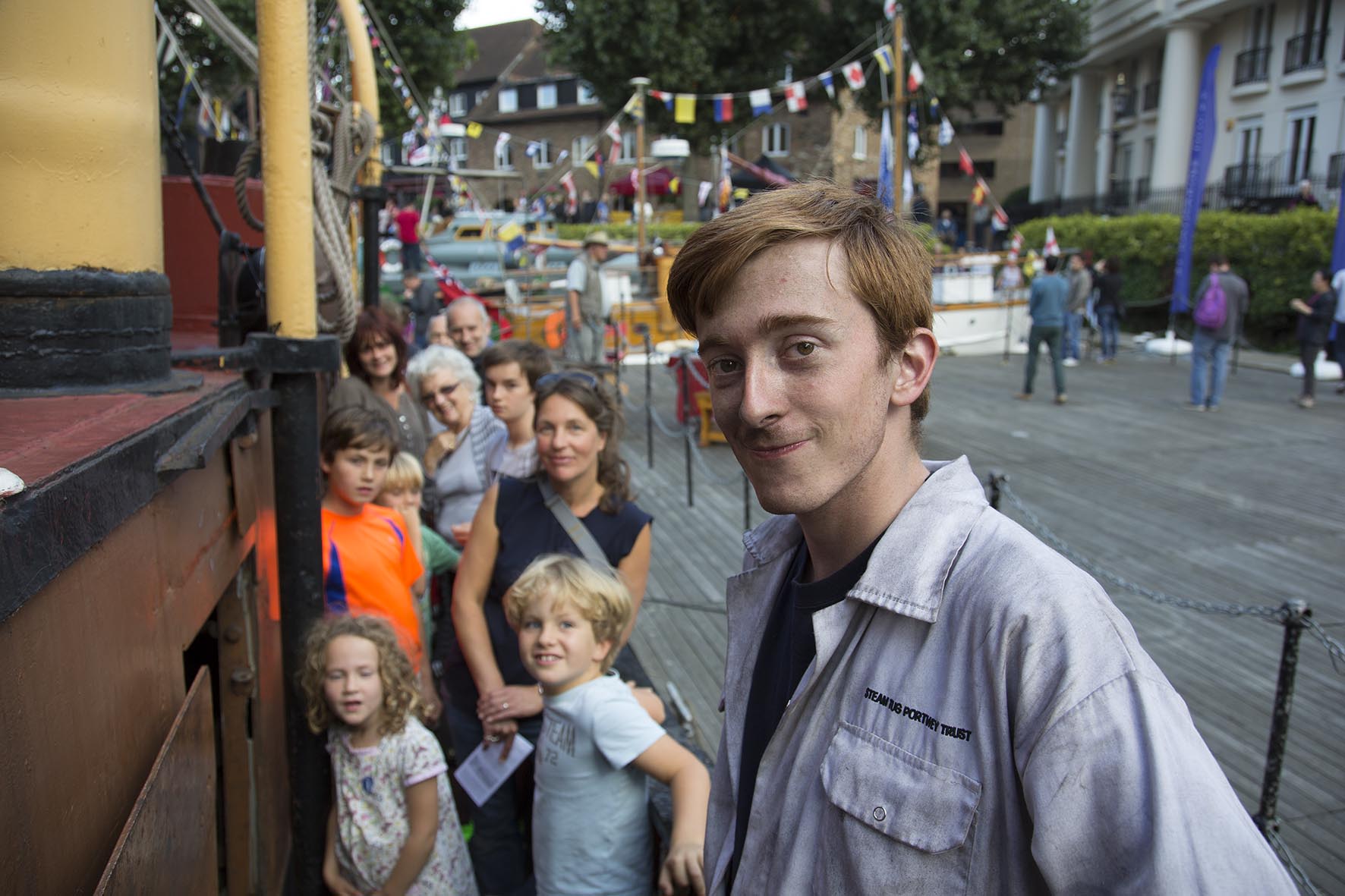  Thames Festival 2014. Volunteer gives a guided tour aboard a steam boat.  For Totally Thames.  