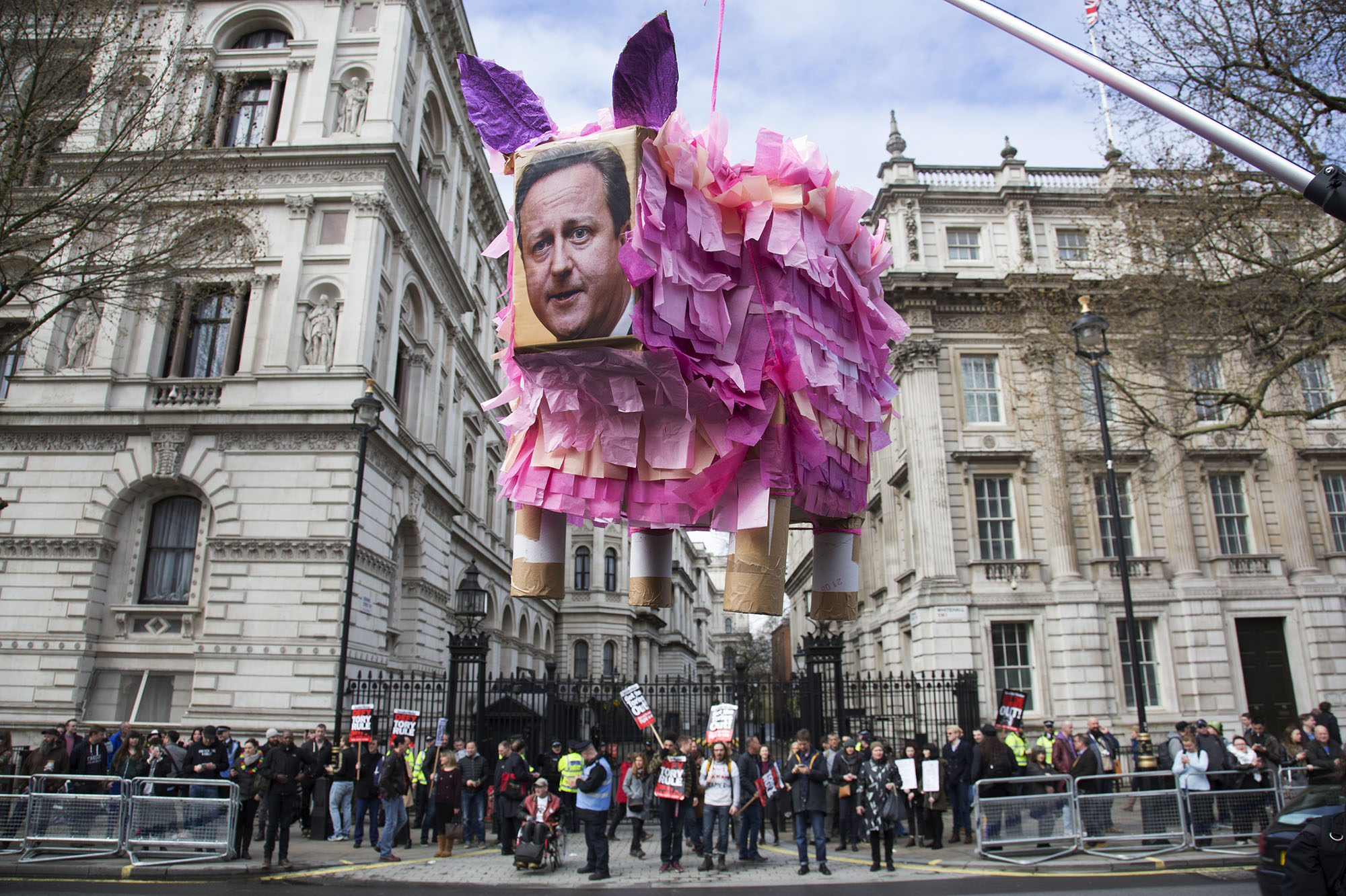  David Cameron pig shaped pinata during a demonstration outside Downing Street as protesters gather against David Cameron’s links to offshore finances. 