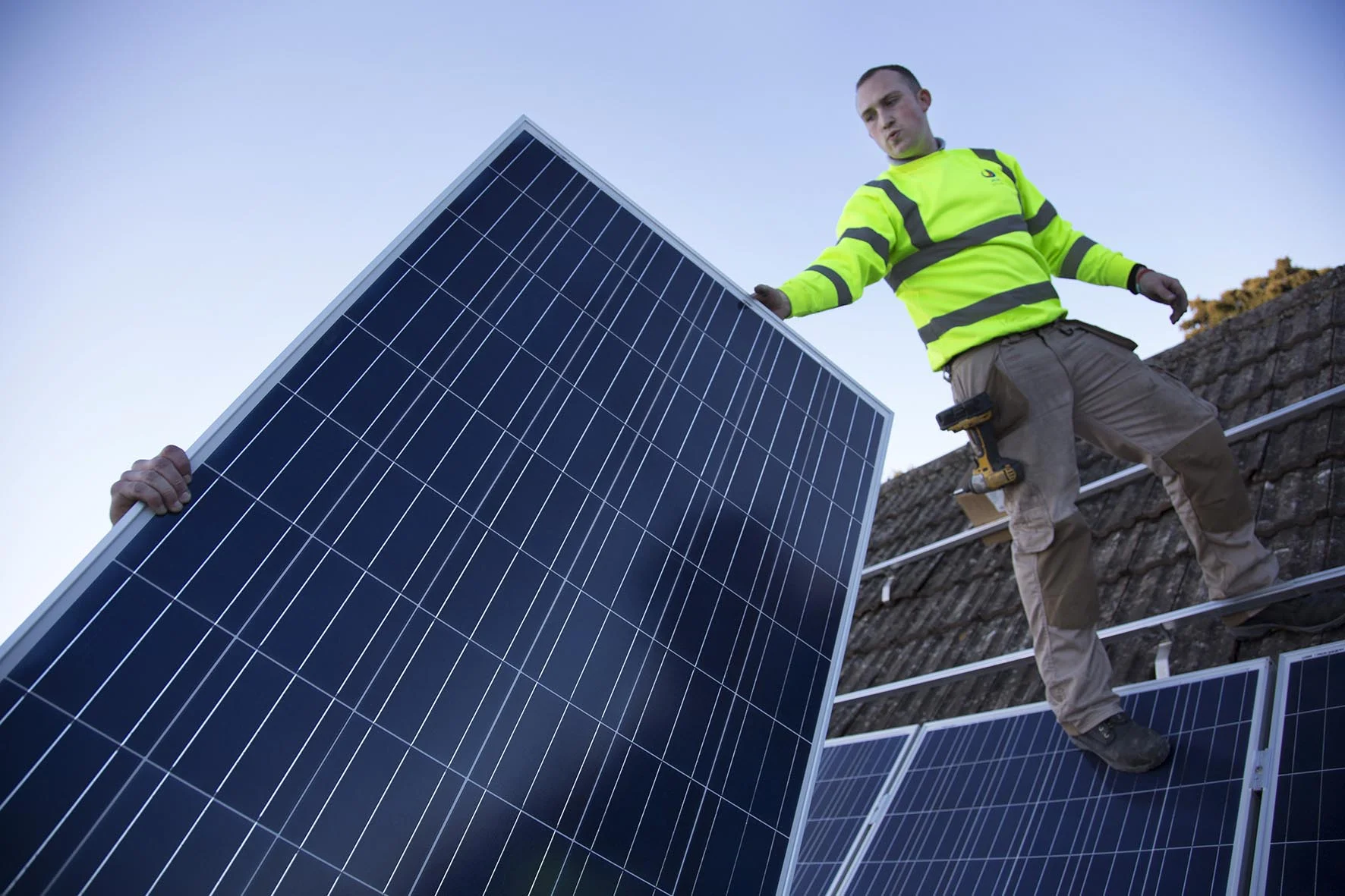 Solar panels being installed as part of a renewable green energy policy. For Joju Solar.
