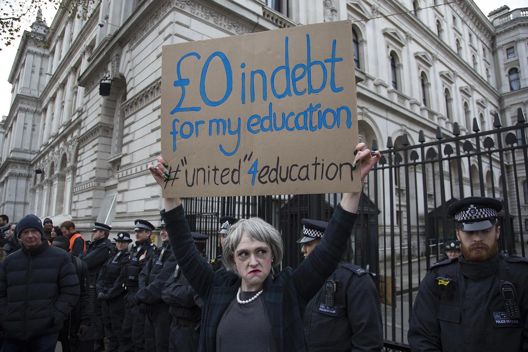 Protester dressed as Theresa May outside Downing Street during student demonstration in London.