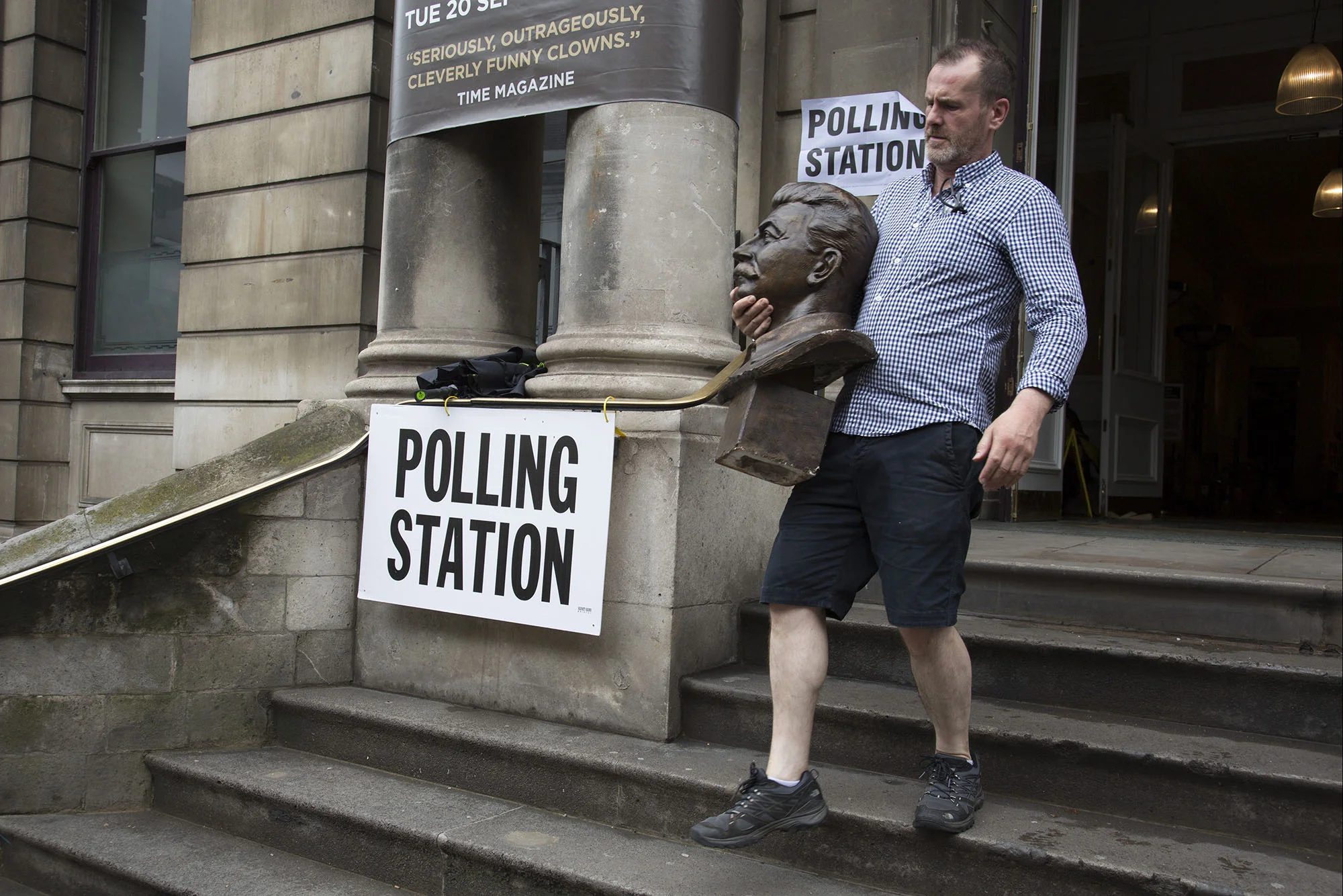 Workman removes the head of Joseph Stalin at Shoreditch Town Hall during the EU Referendum polling day on June 23rd 2016.