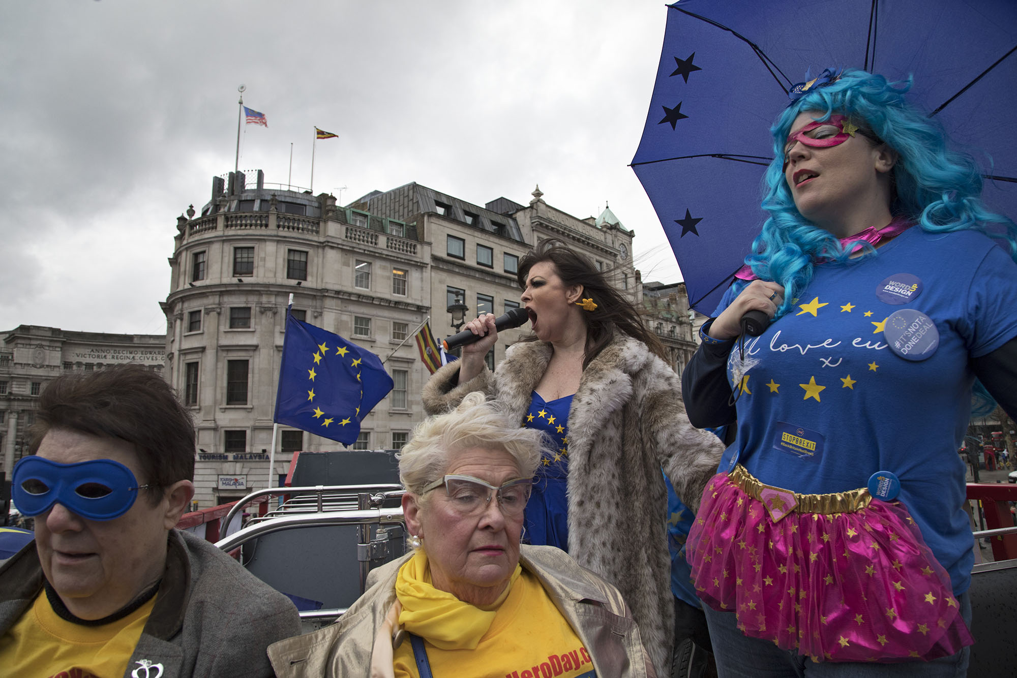  With one year to go until Brexit, anti-Brexit demonstrators protest aboard an EU superhero Brexit battle bus. 
