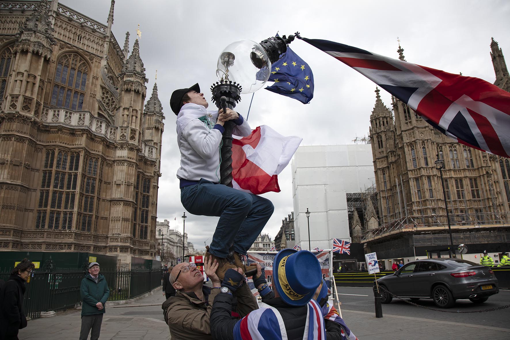 Brexit protesters attempt to rescue a falling street lamp in a scene reminiscent of Raising the Flag on Iwo Jima, the iconic photograph taken by Joe Rosenthal, in Westminster on 4th April 2019. 