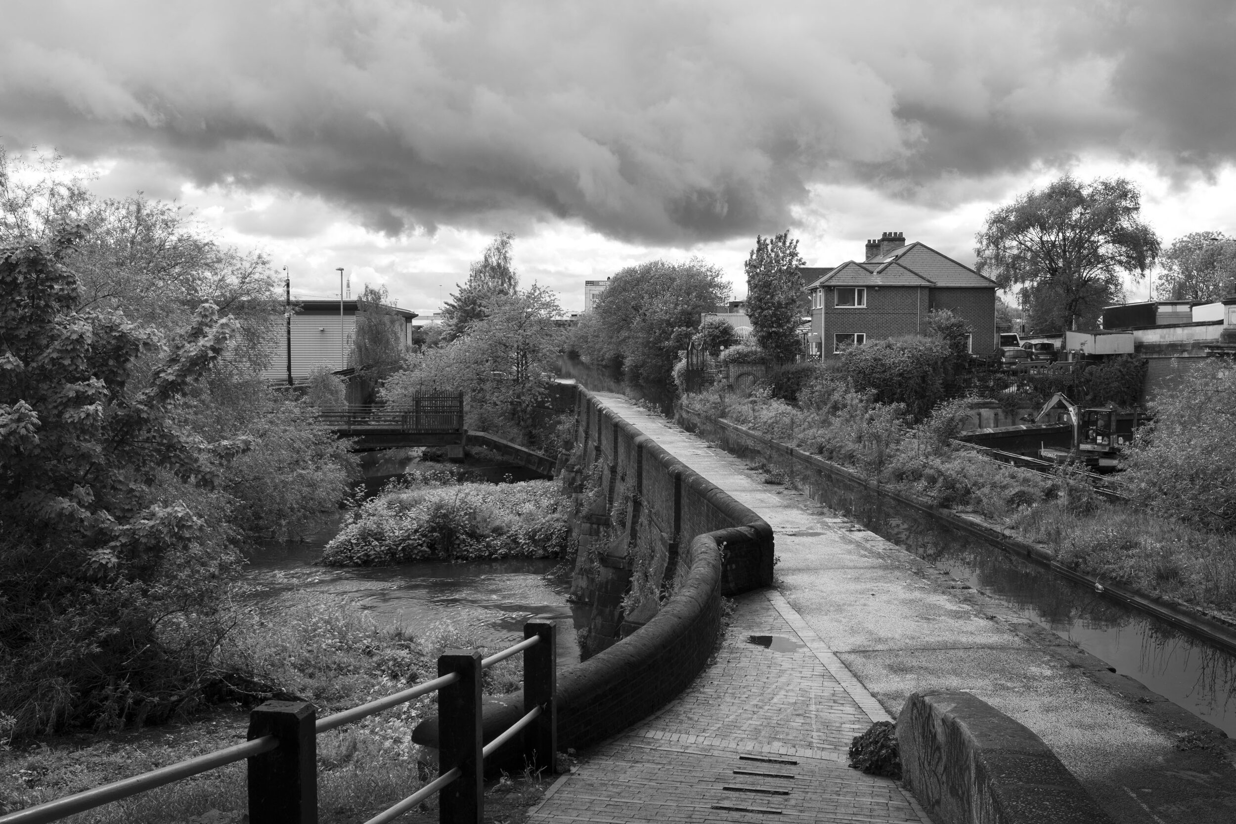  River Tame passes underneath the Birmingham and Fazeley Canal. April 2020. Gravelly Hill. 