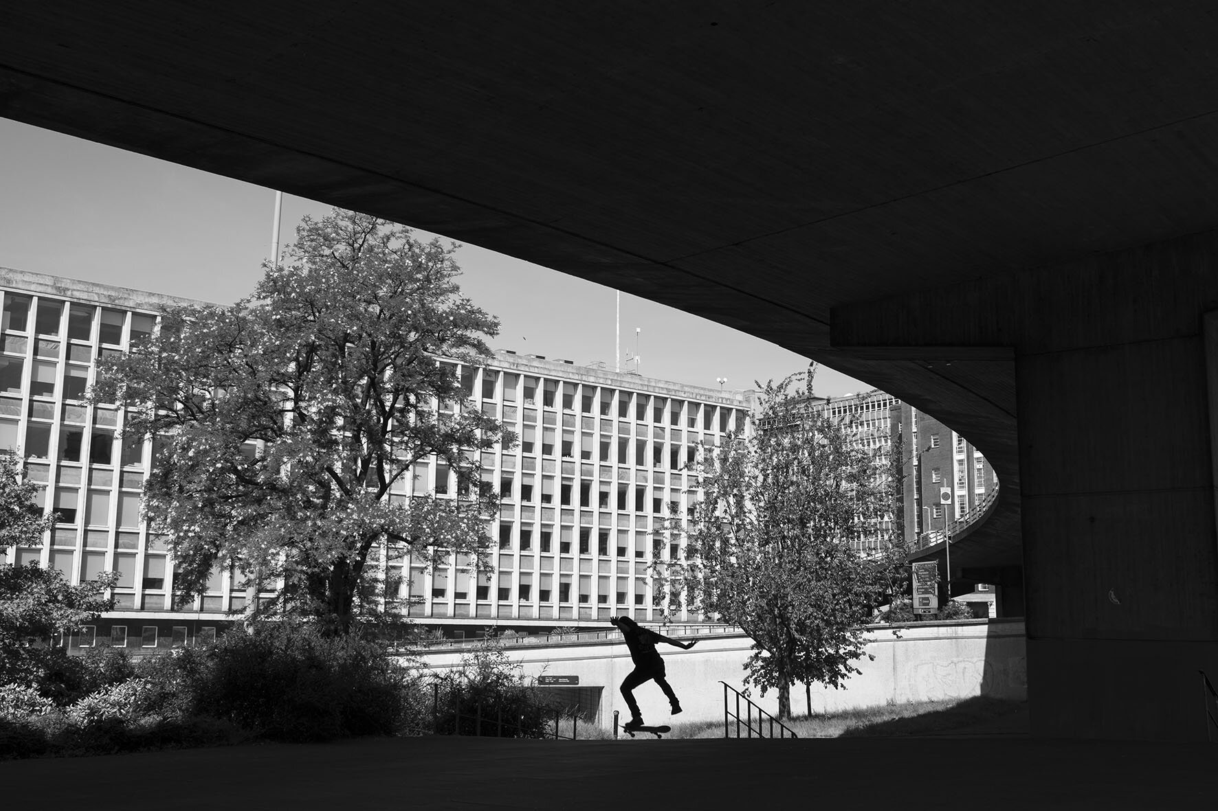  Skateboarders underneath the A38 Aston Expressway enjoy the peace in this cathedral-like space under what is normally one of the busiest roads. May 2020. City Centre. 