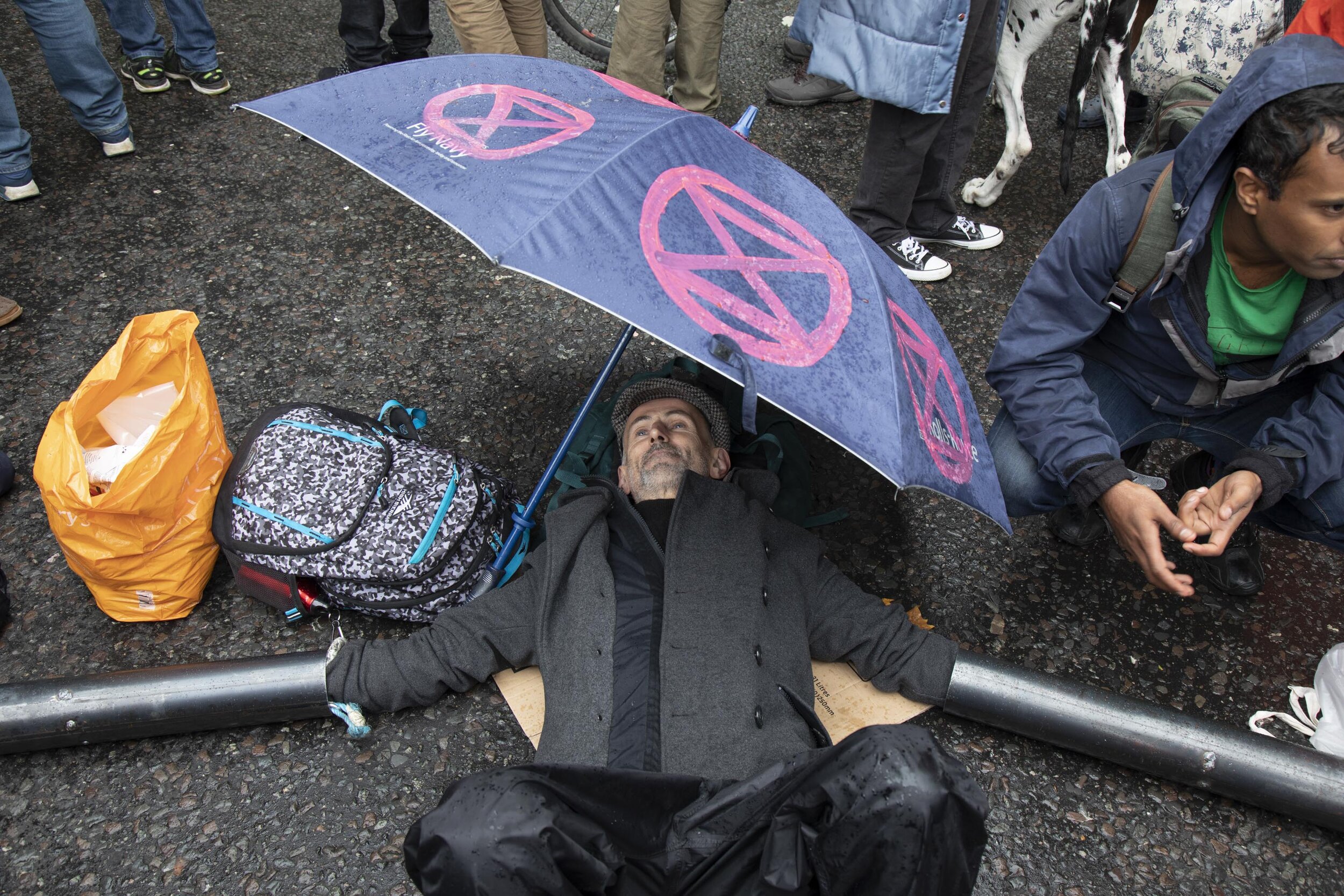  Activists locked on as disruption begins and protesters block 12 sites around Westminster. 