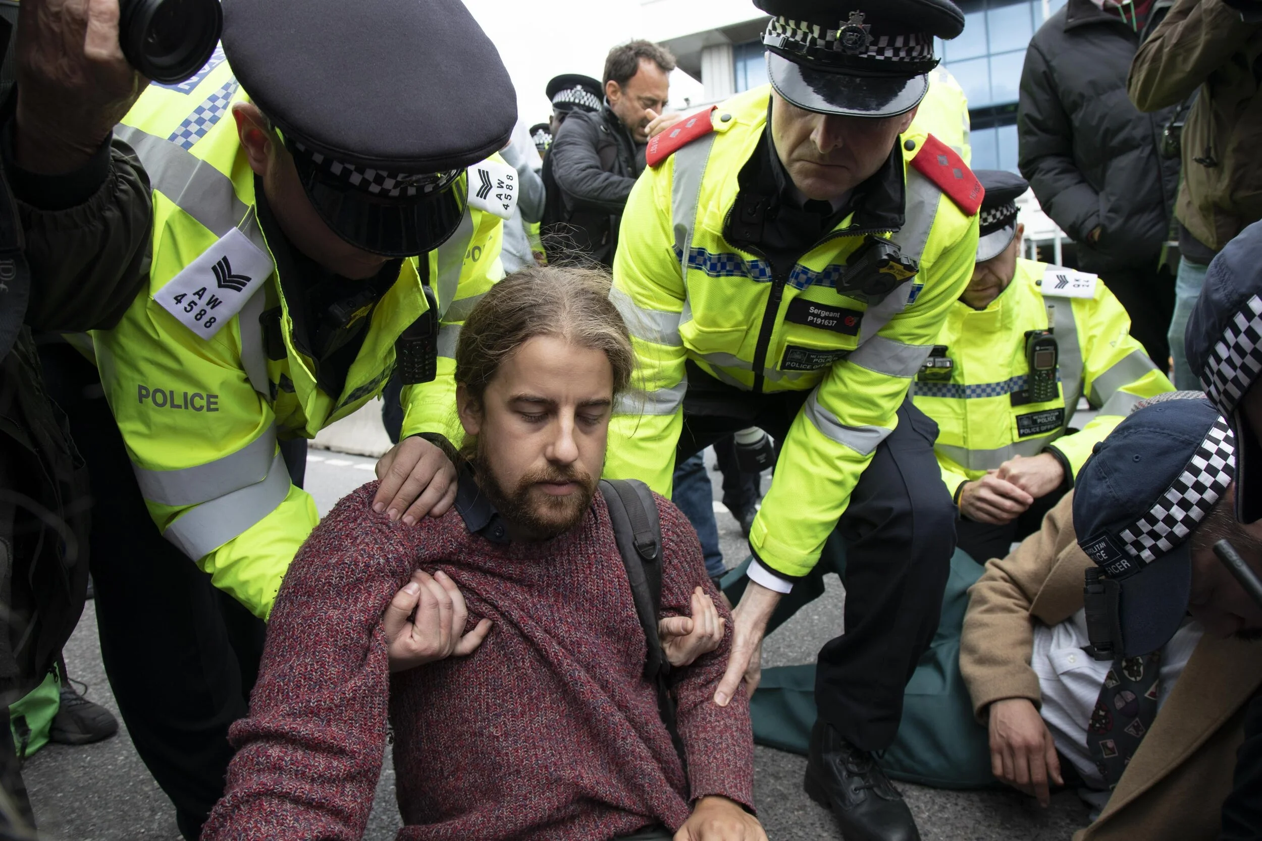  Police read section 14 notices and arrest protesters during disruption outside City Airport. 