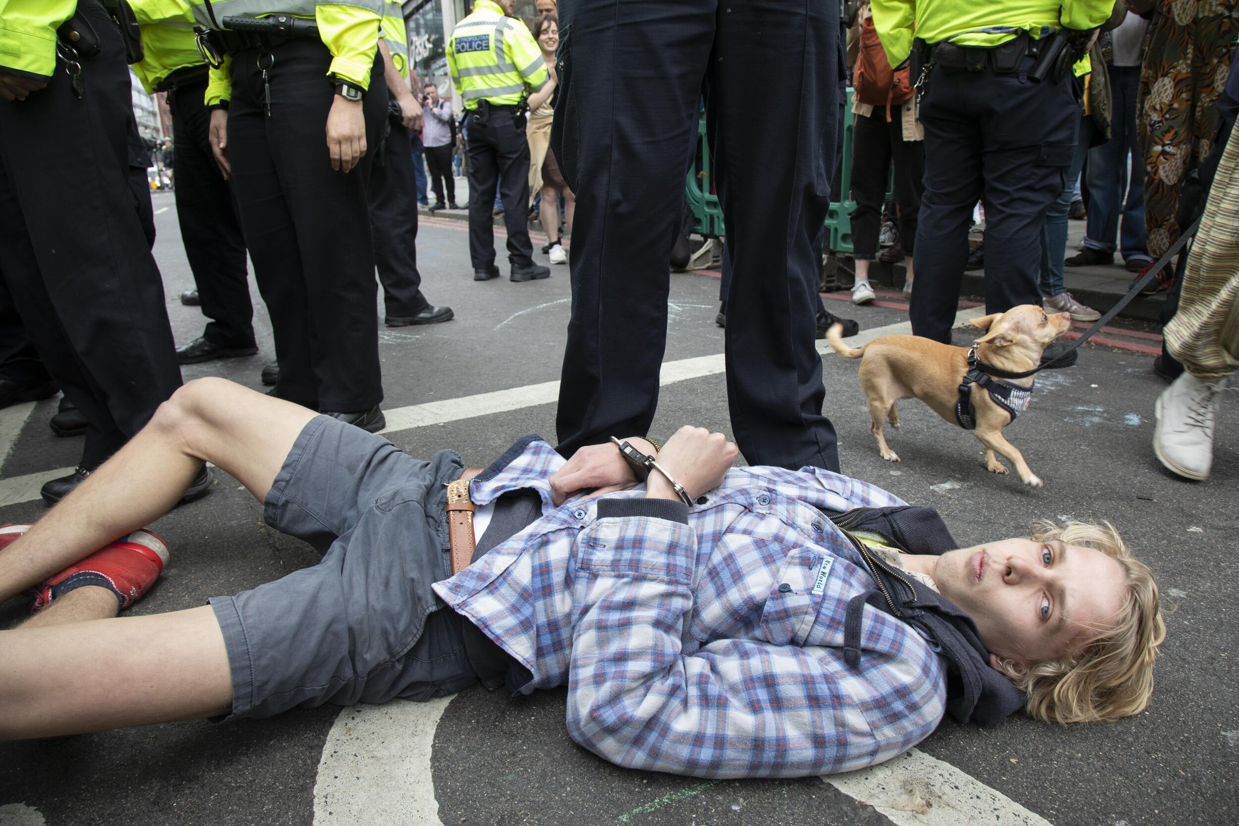  Police arrest and remove protesters as they try to clear climate change activists at Oxford Street near to the Marble Arch camp. 