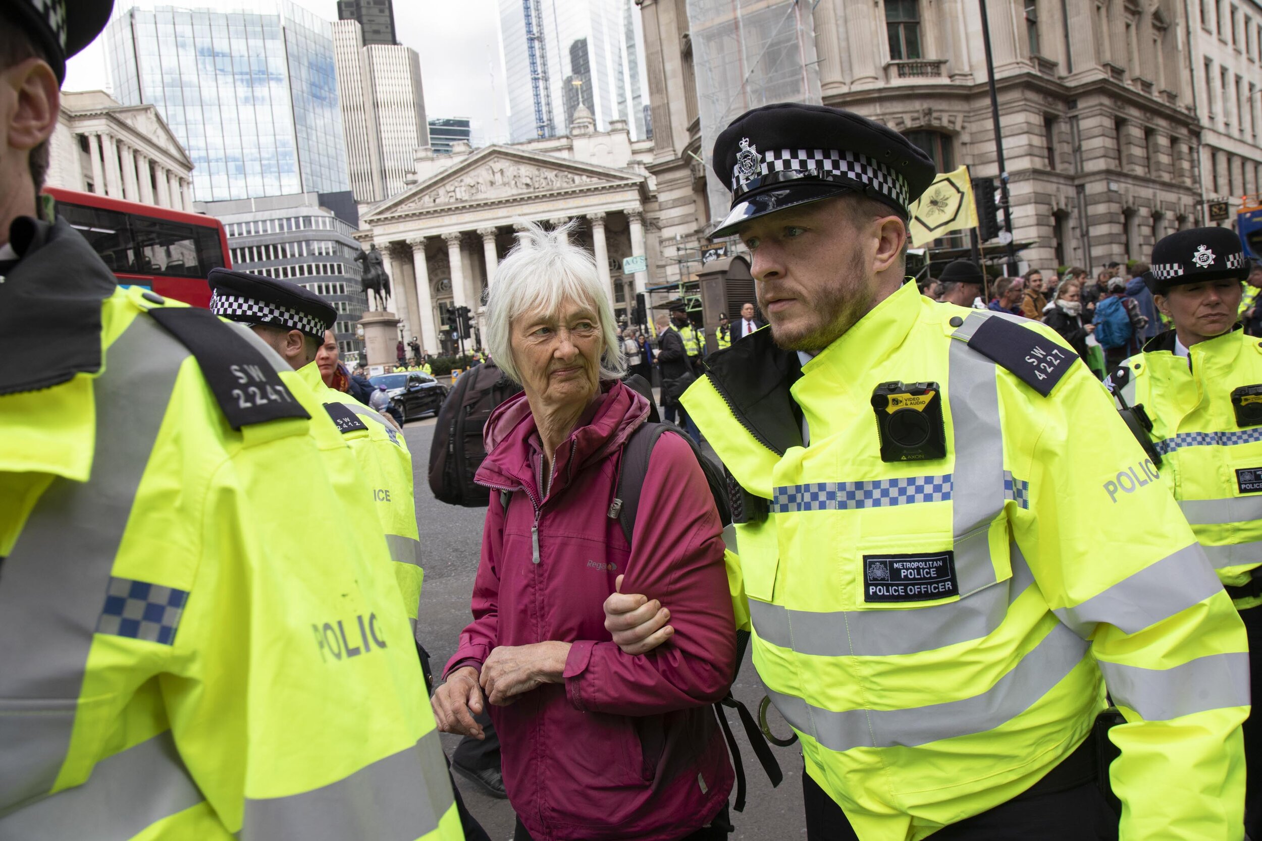  Elderly activist is arrested for blocking the street at Bank in the heart of the City of London in protest that the government is not doing enough to avoid catastrophic climate change. 