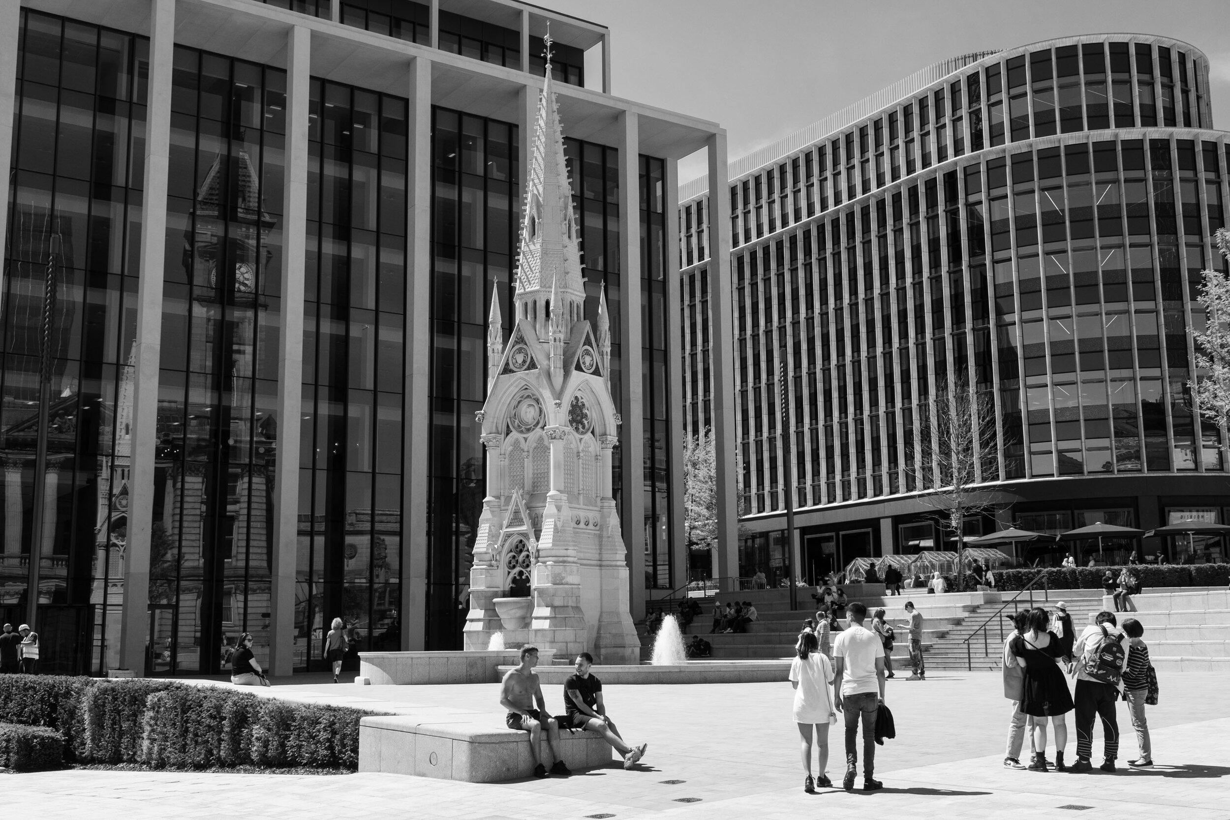  In the newly renovated Chamberlain Square there is a feeling of people really hanging out in groups and almost as if the end is in sight. June 2021. City Centre. 