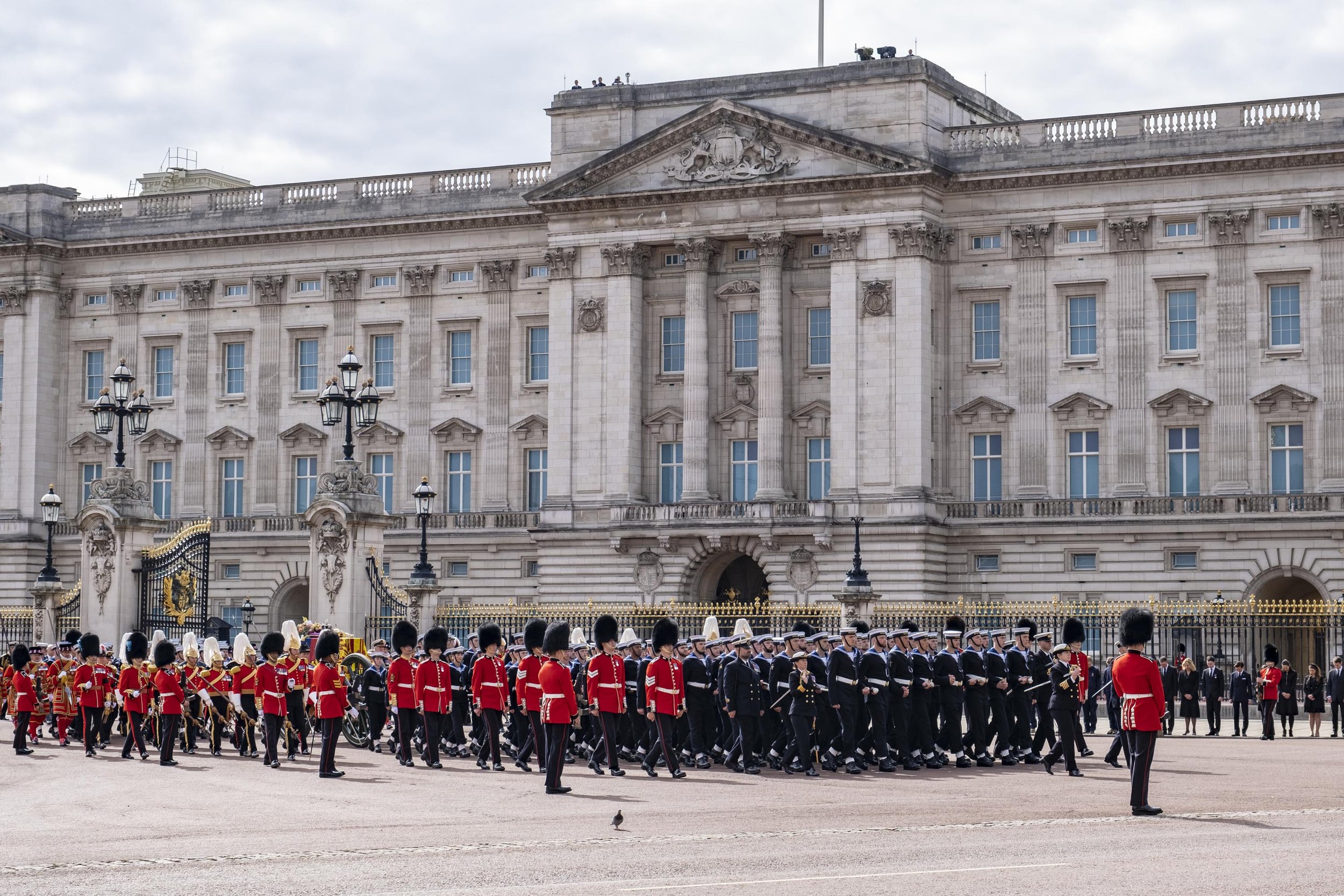  State Gun Carriage pulled by 142 Royal Navy personnel passes Buckingham Palace. 