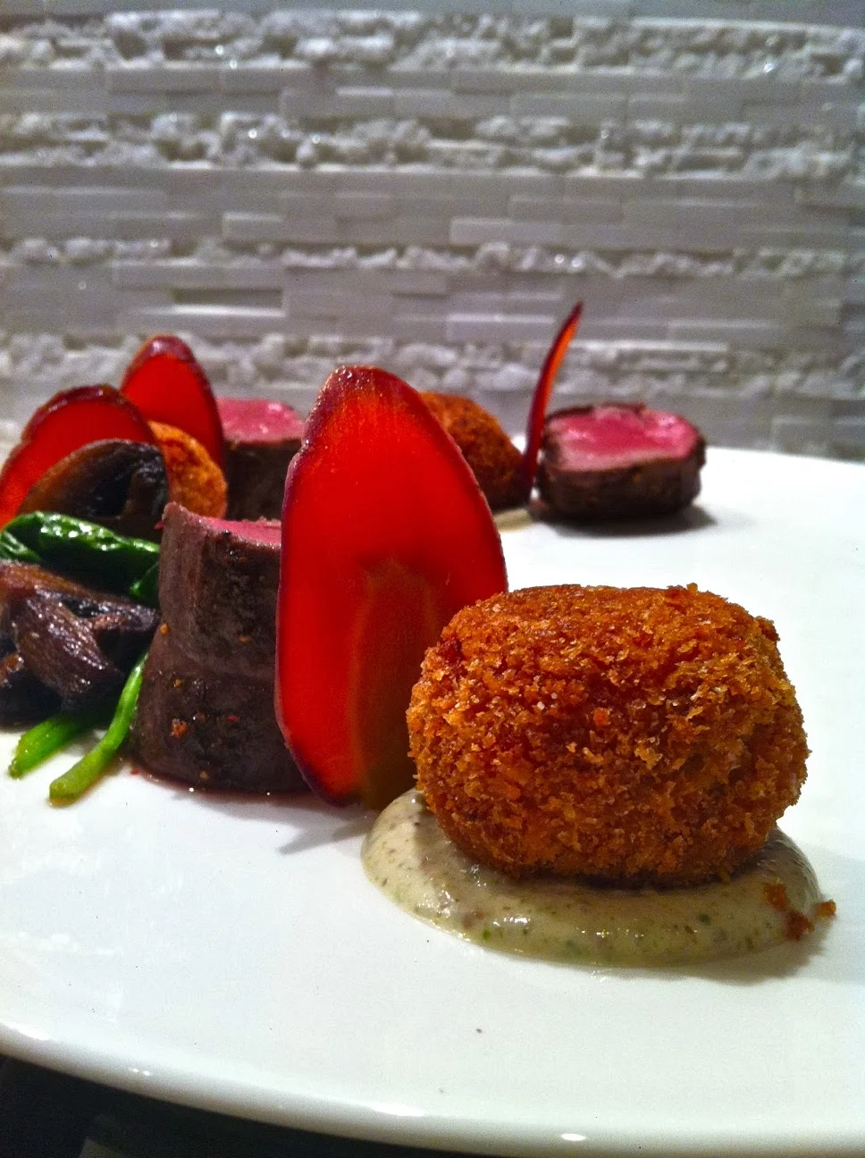 Sous Vide Venison Tenderloin with Beet Arancini Di Riso and Tarragon Sauce