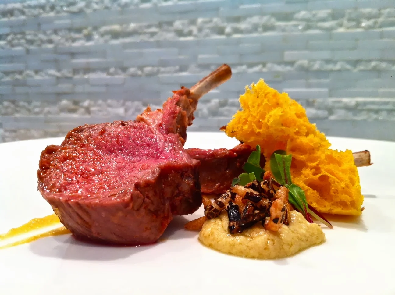 Harissa Baby Lamb Rack with Puffed Wild Rice and Sweet Potato "Brioche"