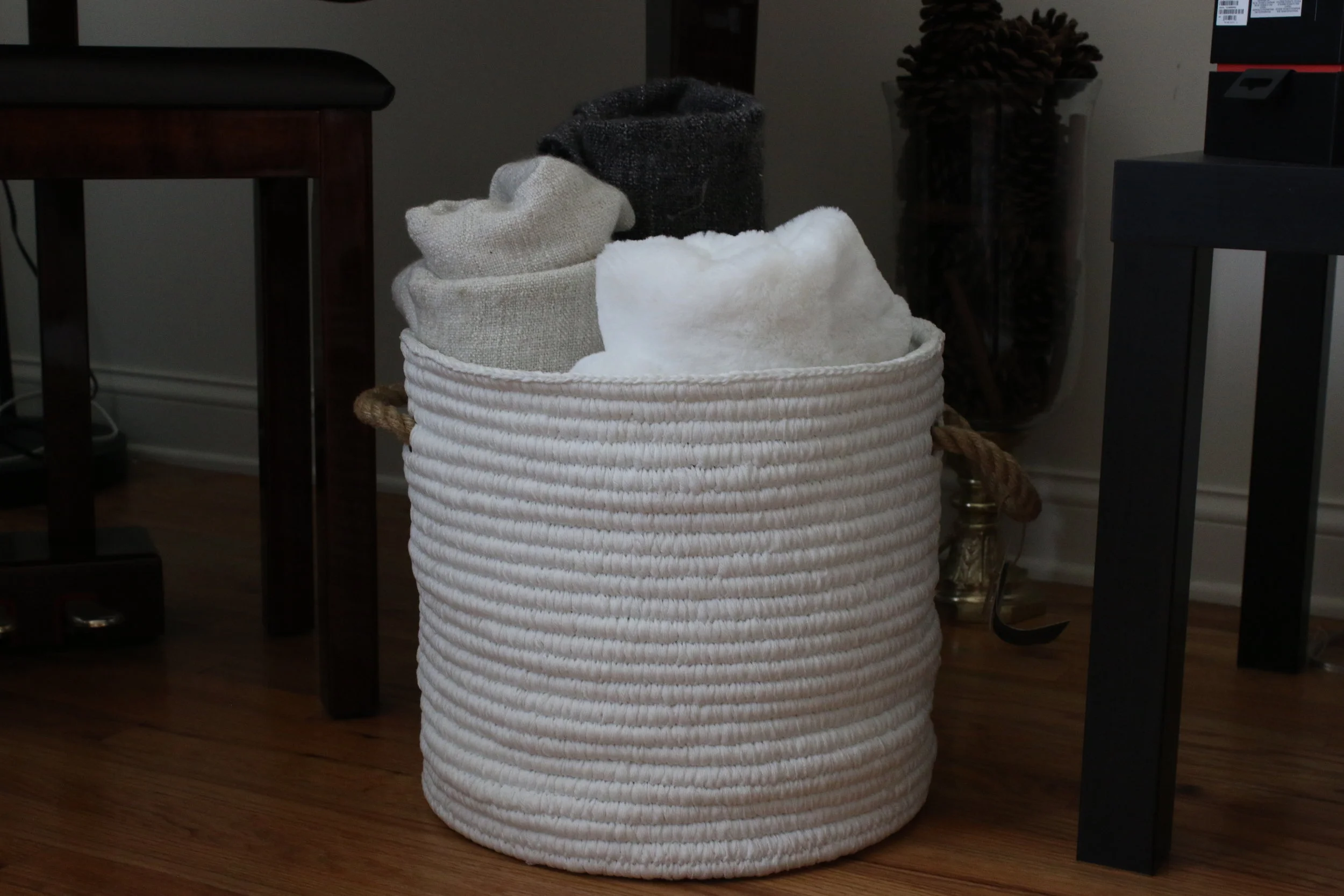 The rope basket and the fury throw I got them from HomeGoods, some of the old throws from Ikea