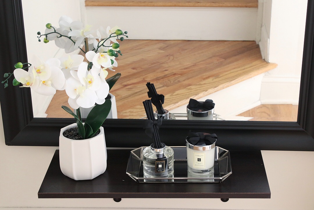 So in the hallway by the stairs, we put the 3ft old mirror we have and my husband put up a shelf for me to put some decorations. So I got this faux orchid from Marshall or HomeGoods, and I put some scented diffuser from Jo Malone. It smells so nice, even the candle I have not use it yet.