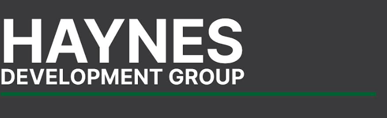 Haynes Development Group logo with white text on a dark gray background and a thin green line underneath.