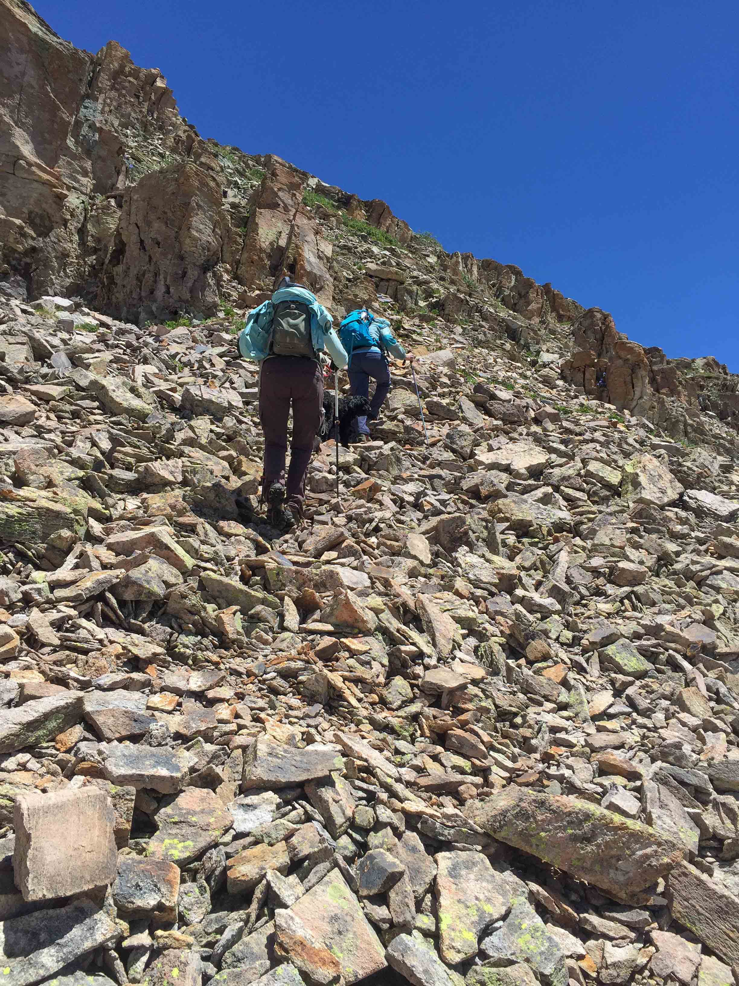 But we have to climb up a few ridges in order to reach the pass. Penny & Jane Marie head up the steep talus