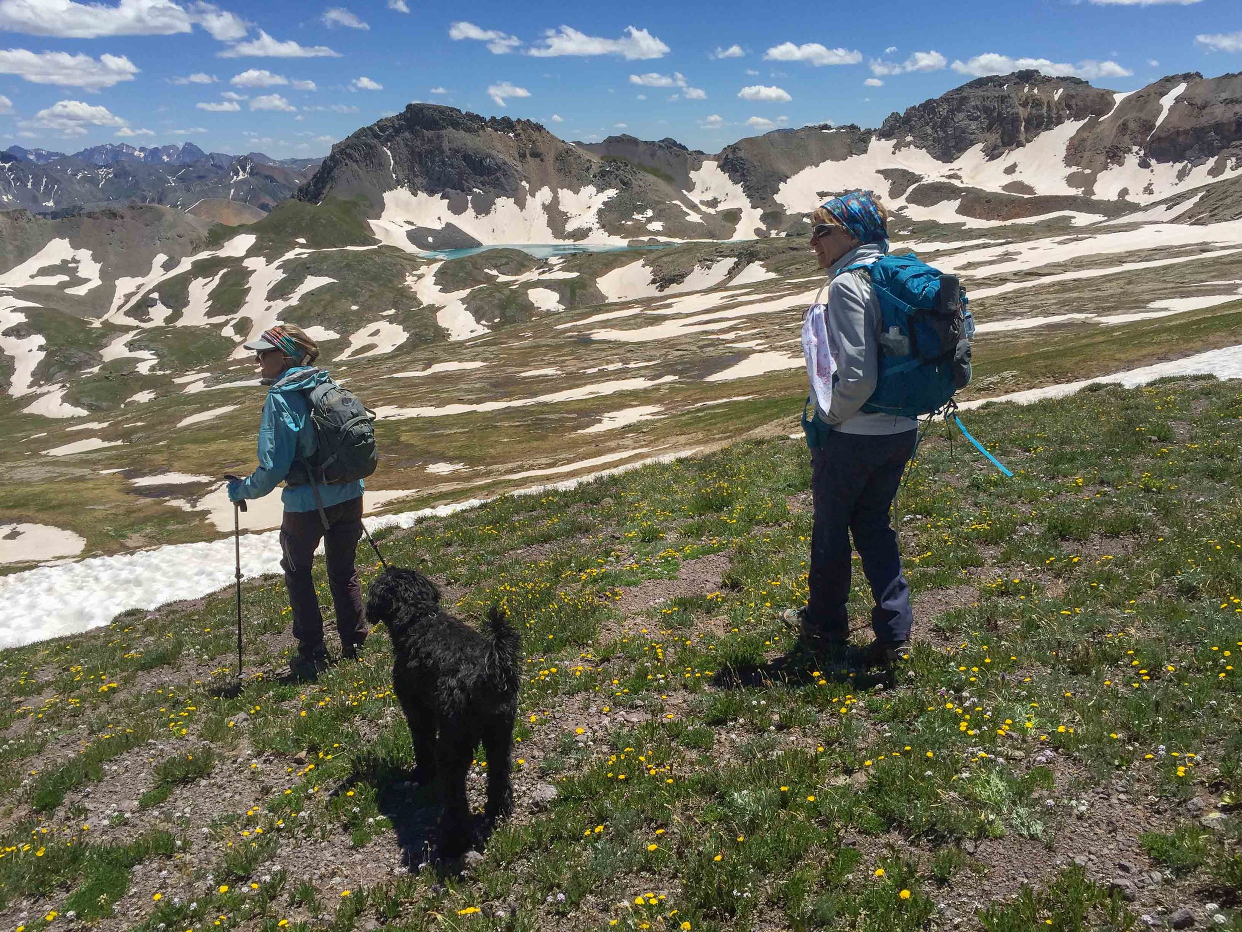 Penny, Jane Marie and Bella start the hike down from Columbine Pass-Columbine Lake in the distance