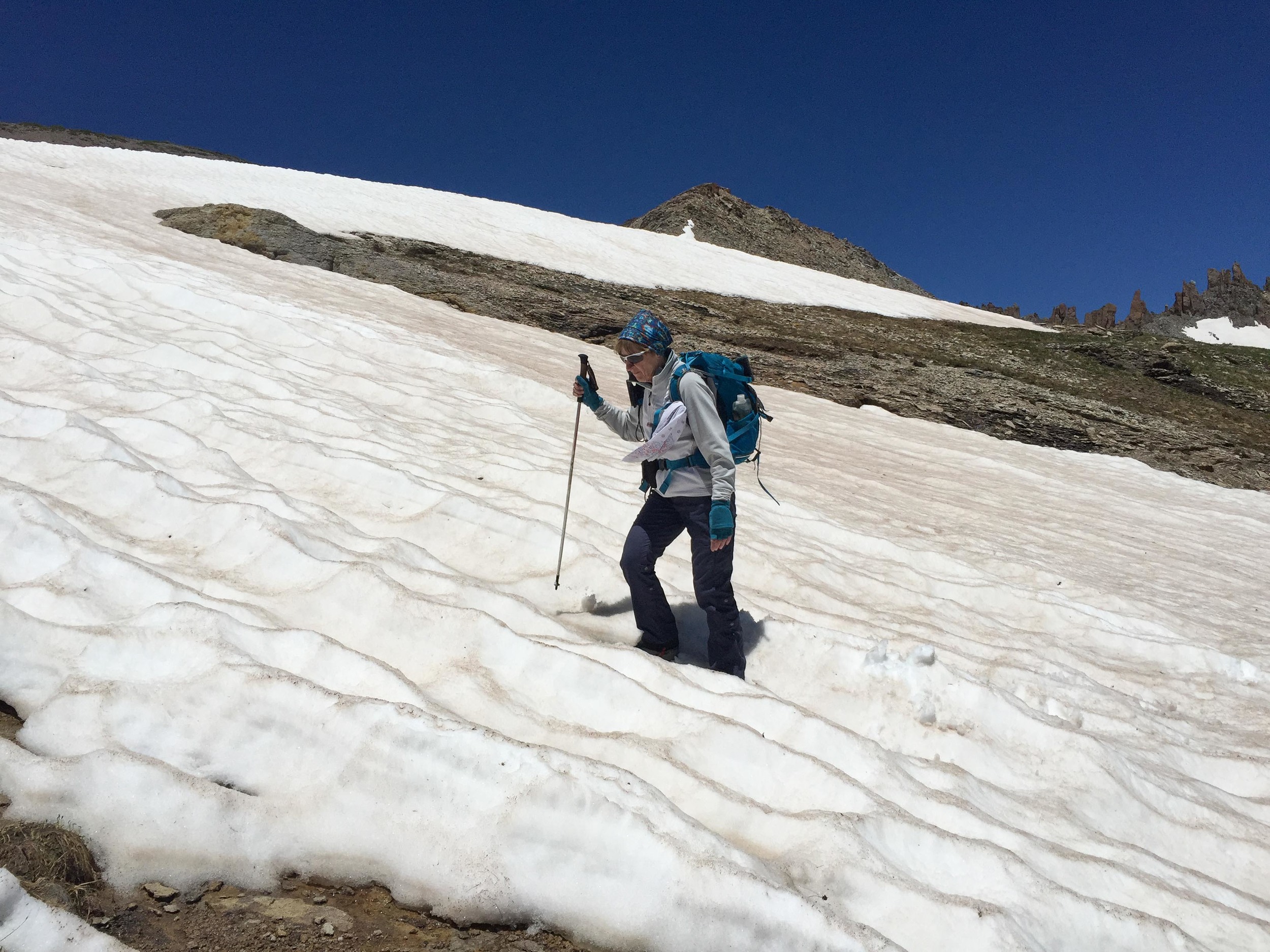 Penny crossing upper snowfield near Columbine Pass