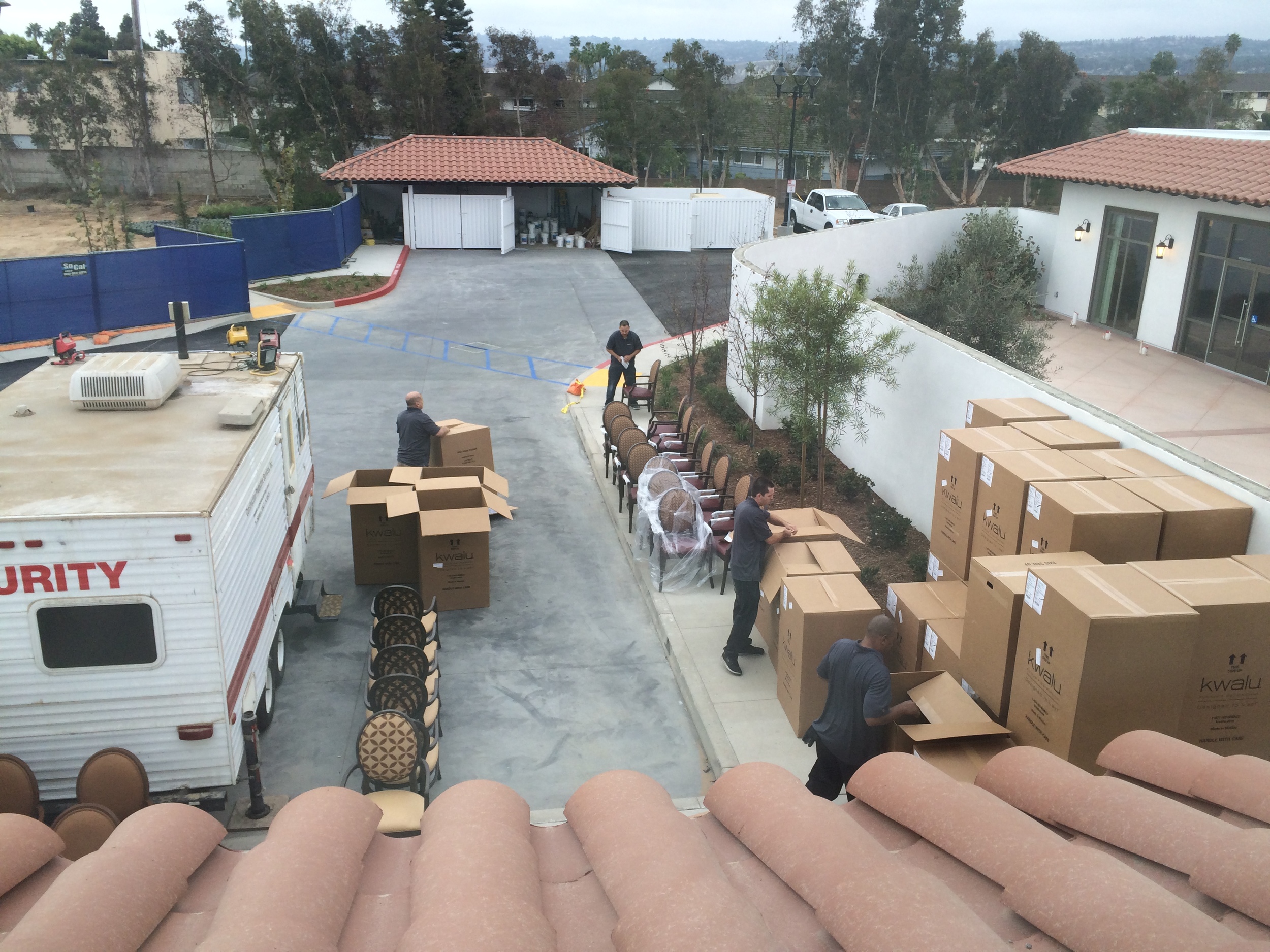 Monday morning the furniture arrived! The workers are preparing to unbox and place the pieces into the living spaces..