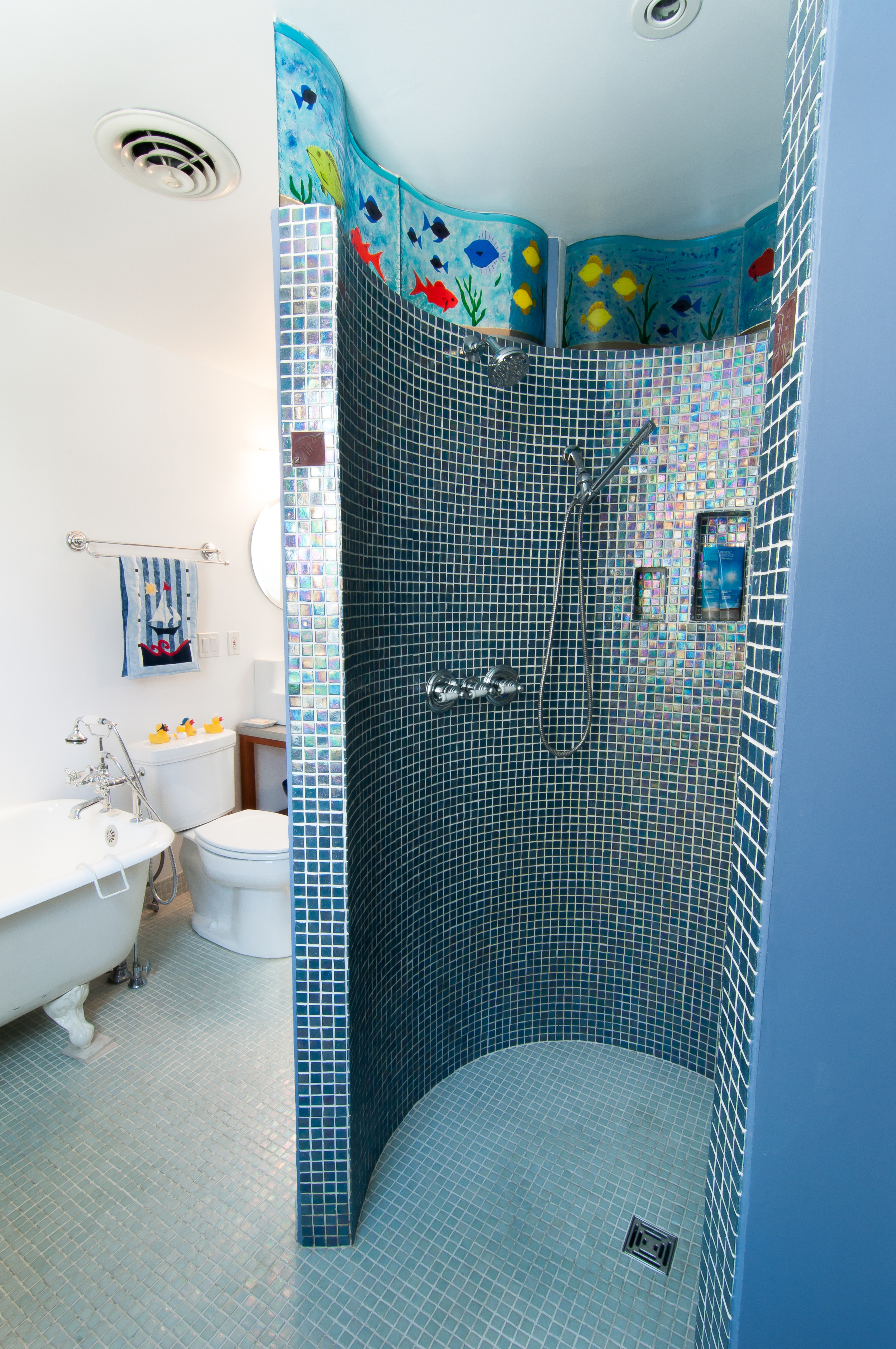 Custom tile work and mosaic glass in the walk out shower. 