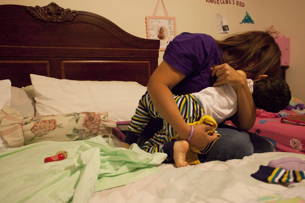 Jacel hugging her son Bruno at home. Miami, FL