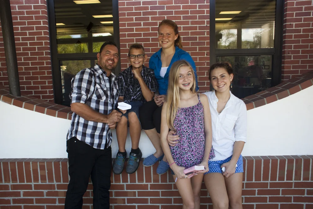 Roby Baird seen here photographed outside with four of his five children: Garrison Baird, Deanna Baird, Kylee Baird, and Jasmine Baird. River Oaks Community Church at R.B. Hunt Elementary School, Saint Augustine, FL.