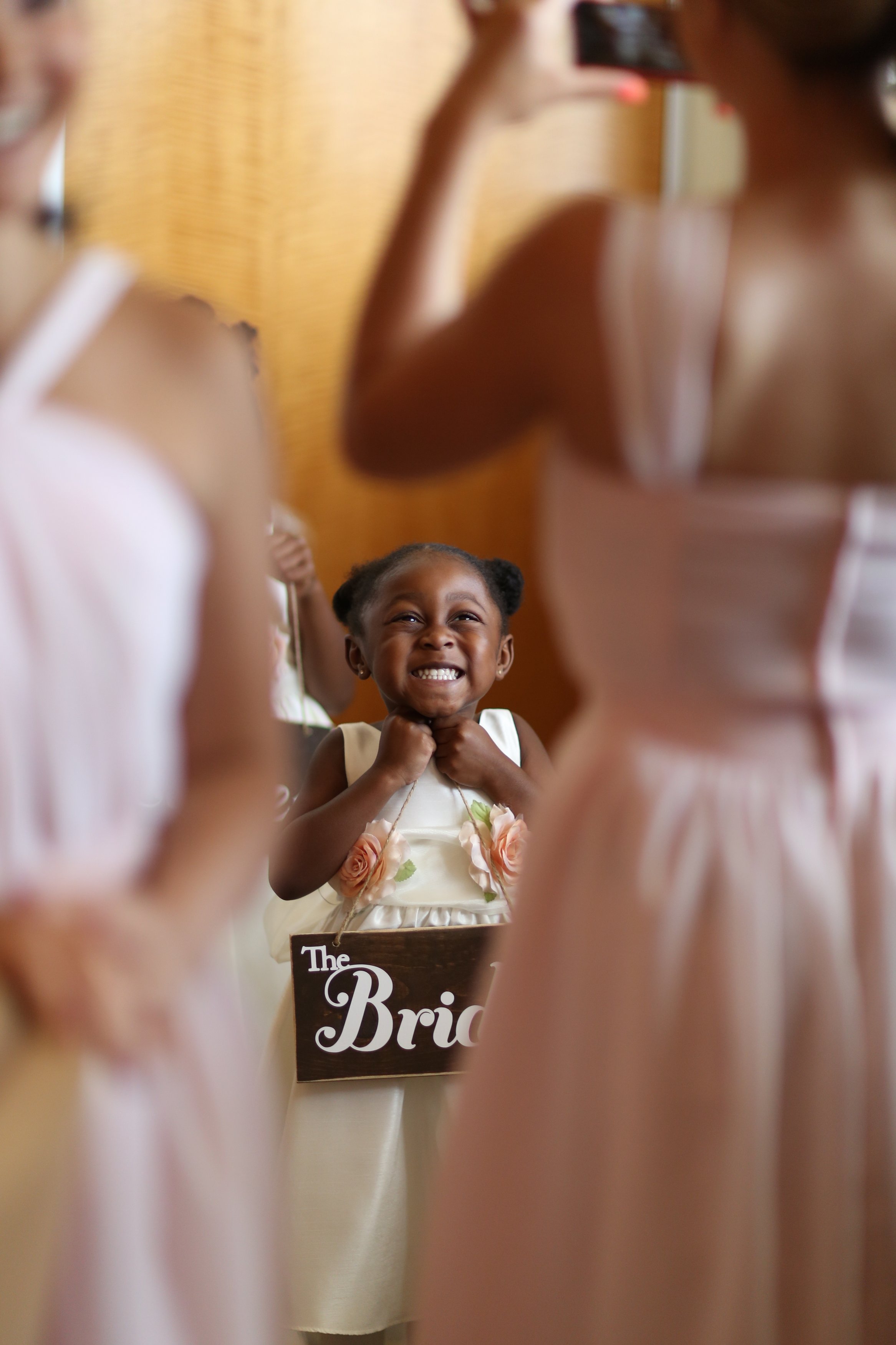 One of the cutest flower girl cheesing for the picture. <3