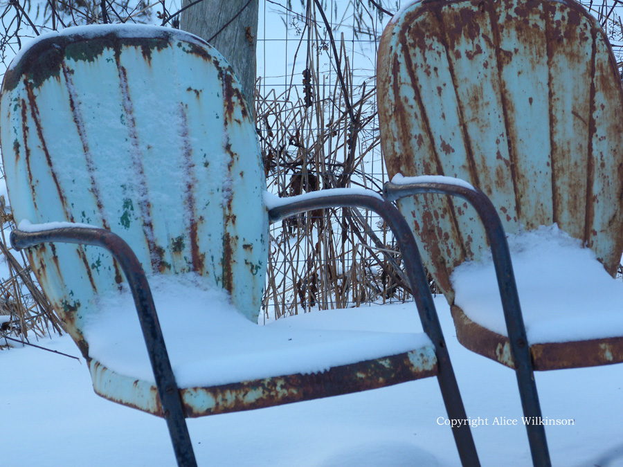  2 chairs in snow 