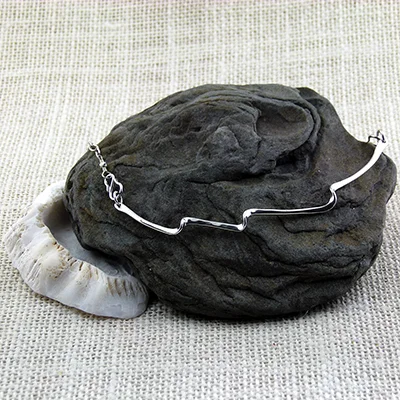 Sterling silver triple wave pendant with sterling silver chain, s-hook closures at front; 16"