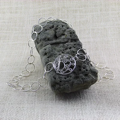 Sterling Silver Chain featuring a sterling silver 1.25" filigree toggle; 22" - $195.