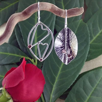 Sterling silver foldform and wire with double hearts earrings - $84.