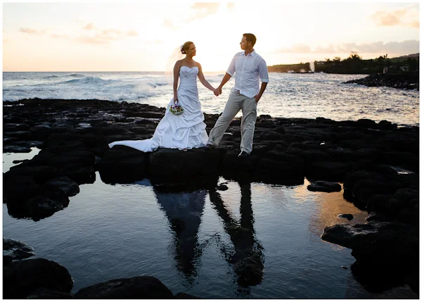 reflection wedding portraits in kauai sunset high surf