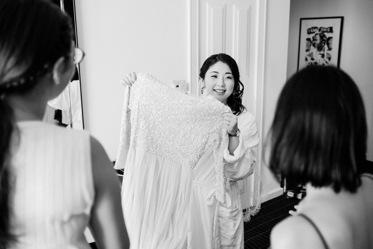  Japanese bride holding up dress 