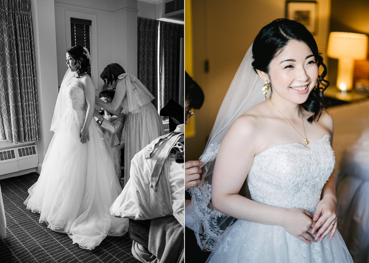  Japanese Bride standing in window getting dress buttoned up and smiling 
