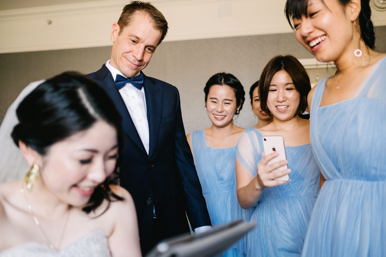  Bride from Japan laughs in response to iPad wedding guest video 
