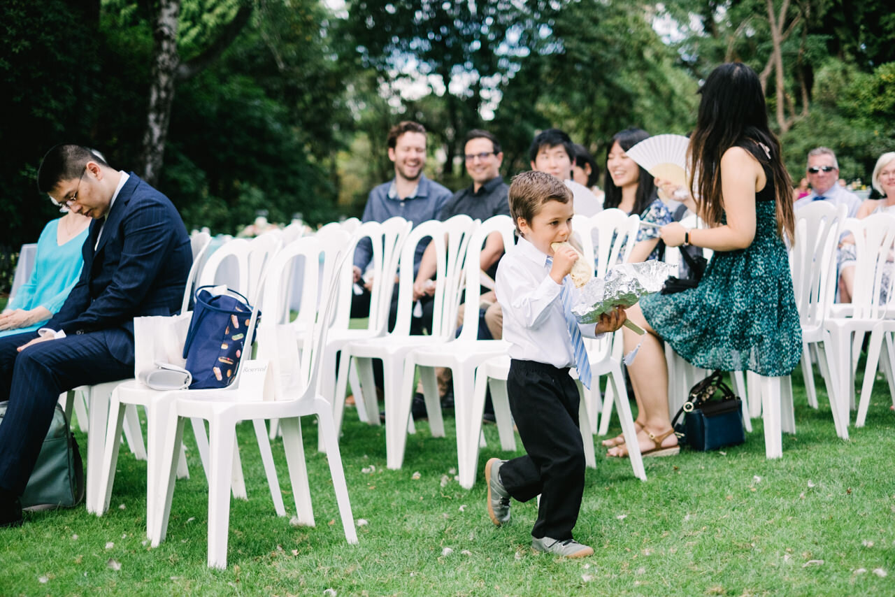  Ring bearer eats burrito while waiting for ceremony 