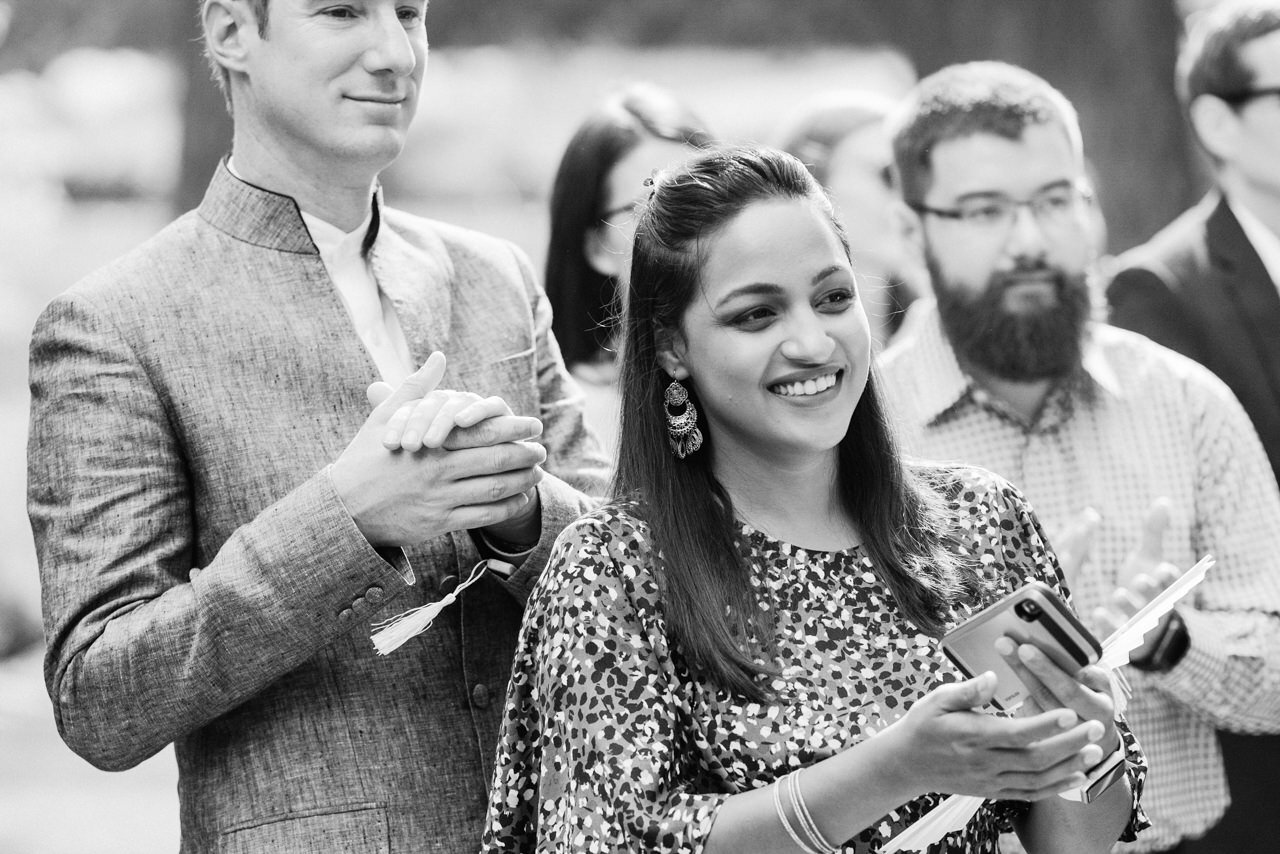  Wedding guests clap as ceremony begins 