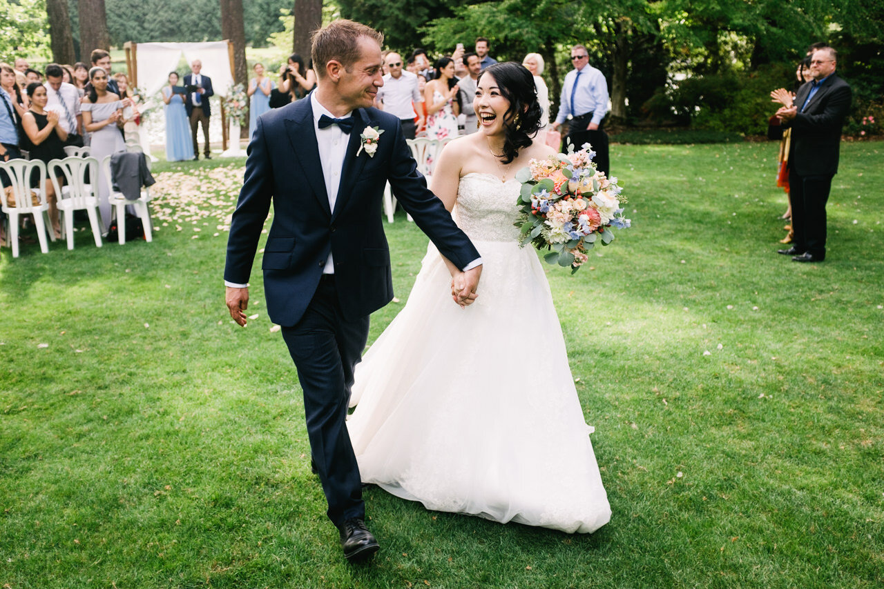  Bride and groom leave ceremony together after being just married at crystal springs wedding lawn 