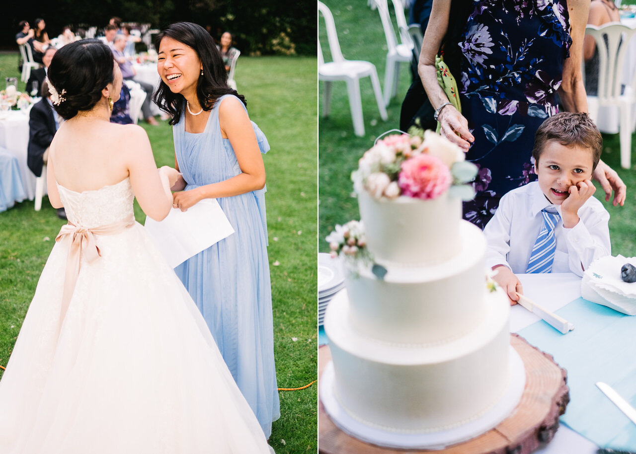  Boy in blue tie waits patiently to eat wedding cake with pink flowers on top 