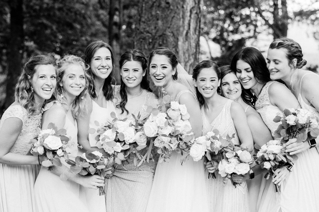  Black and white candid portrait of bridesmaids with bride 