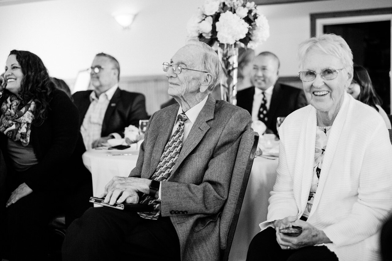  Smiling grandparents during wedding ceremony 
